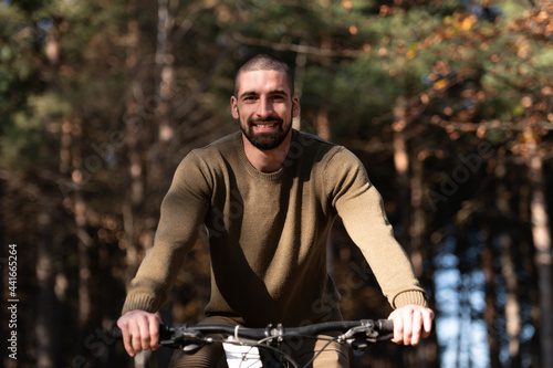 Portrait of Active Man Riding on Bike