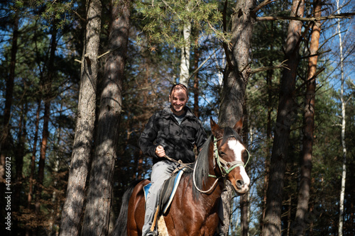 Young Man Sitting on a Horse Outdoors