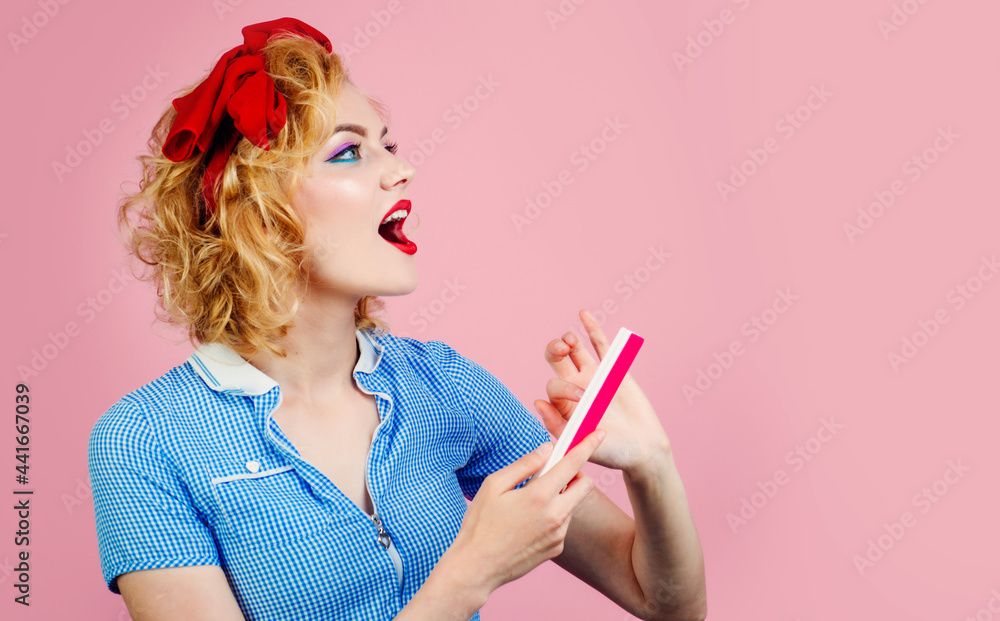 Happy woman with nail file. Manicure tools. Nails care. Young beautiful girl doing manicure. Advertising Beauty salon. Happy woman with nail file. Manicure tools. Nails care. Young beautiful girl doing manicure. Advertising Beauty salon.