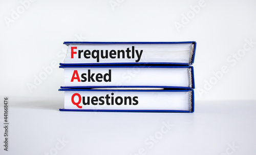 FAQ frequently asked questions symbol. Concept words 'FAQ frequently asked questions' on books on a beautiful white background. Business and FAQ frequently asked questions concept. photo