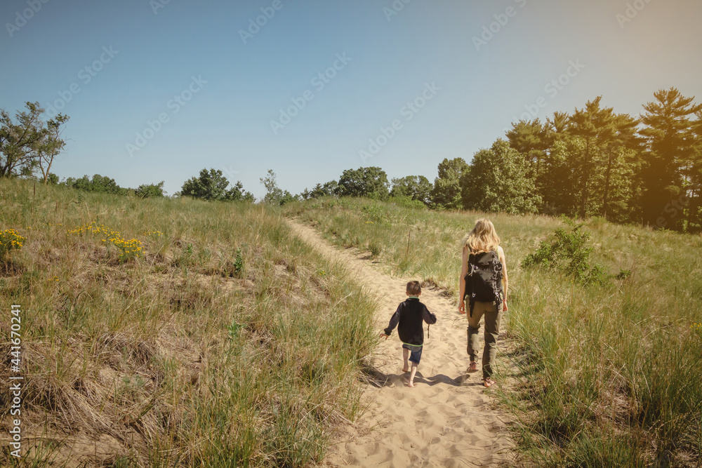 Mother and young son walking along a path at Indiana Dunes State Park