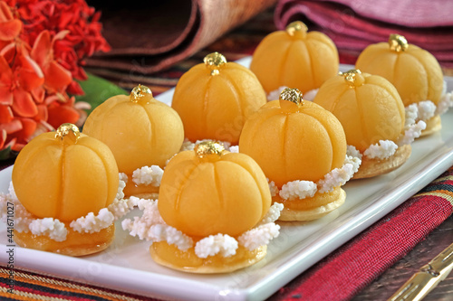 Thai dessert (Royal Thai cuisine) : Golden crown cake (Khanom Dara Thong or Thong Eak krajang) , one of famous nine auspicious desserts in Thai tradition, made from yolk, wheat flour and edible gold photo