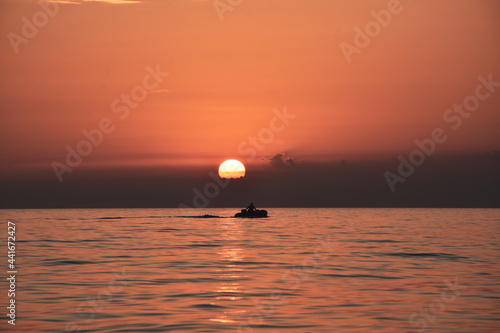 Fototapeta Naklejka Na Ścianę i Meble -  The fisherman returns home at sunset