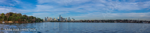 Panoramic view of Sydney Harbour and City CBD Skyline of NSW Australia. The beautiful light skies at sunset lovely blue waters  © Elias Bitar