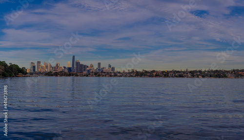 Panoramic view of Sydney Harbour and City CBD Skyline of NSW Australia. The beautiful light skies at sunset lovely blue waters 