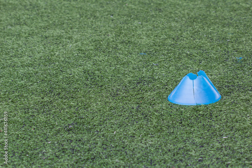 cone on the green soccer field