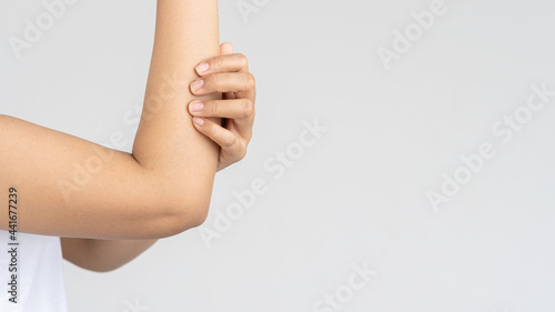 woman having elbow pain, arm pain medical health care concept