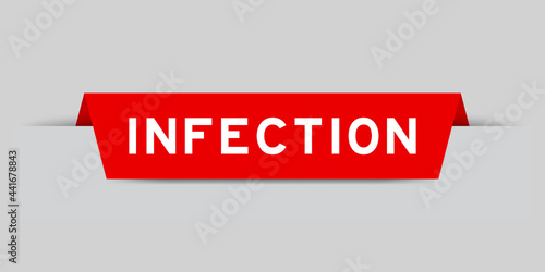 Red color inserted label with word infection on gray background