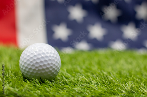Golf ball is on flag of America background