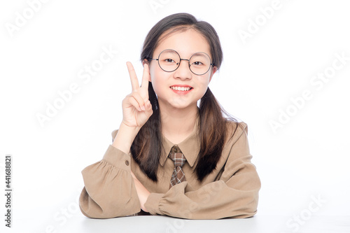 Asian little girl with eyes on white background