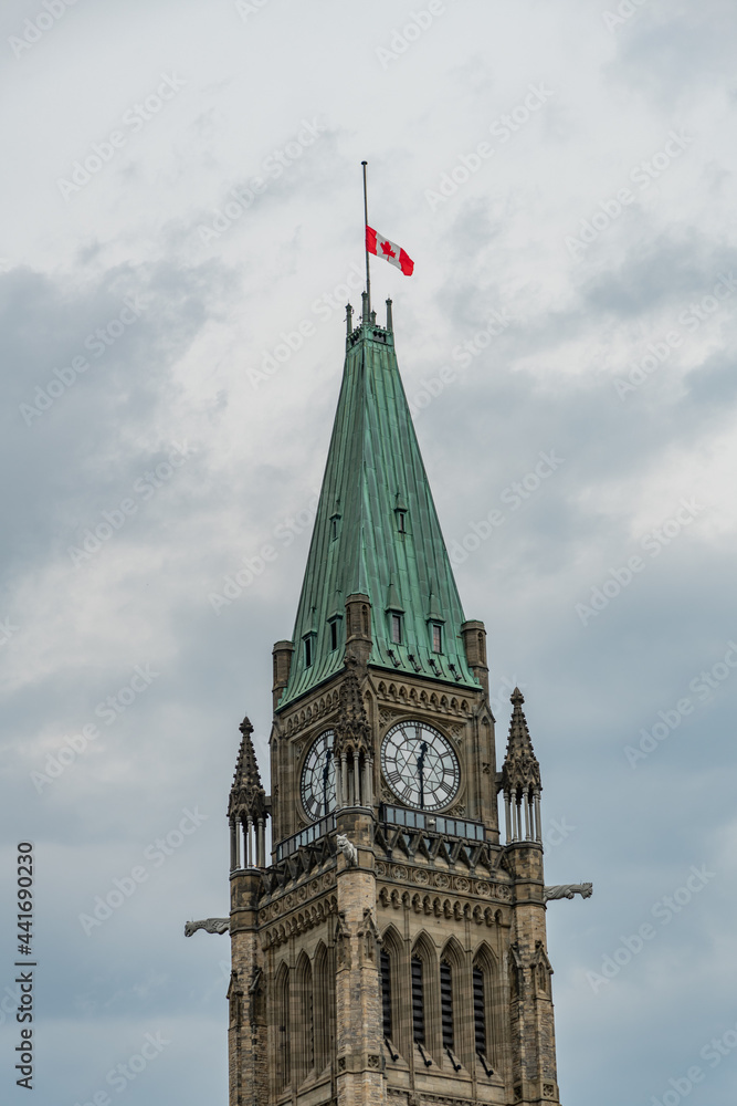 Parliament in Ottawa Clock Tower with flag at Half Mast