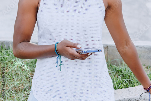 view of a telephone in the hand of an african american woman