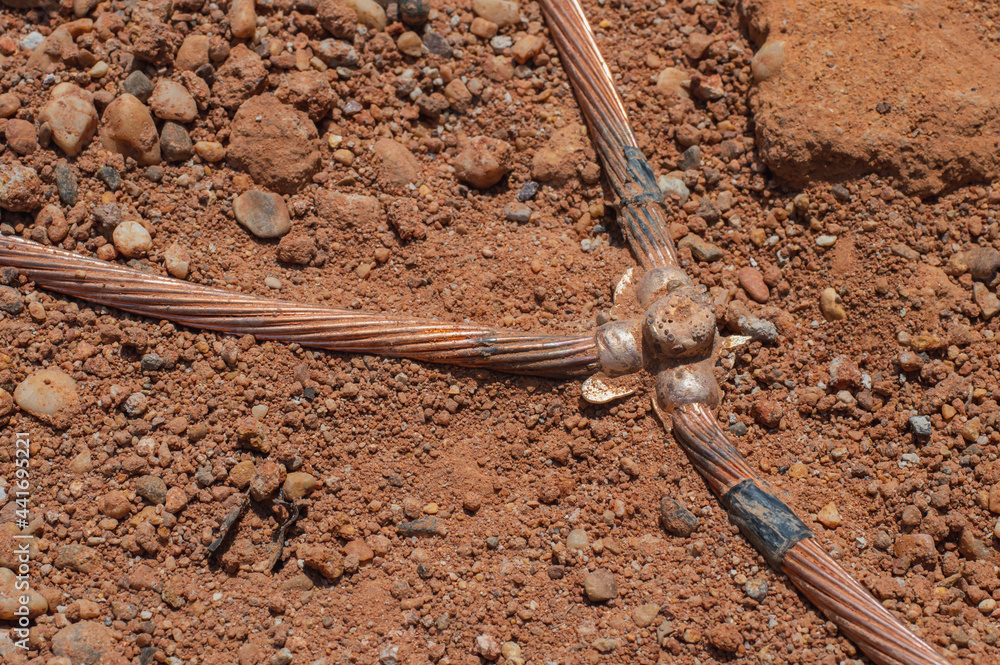 Welding copper ground wire on ground rod.Welding copper ground wire