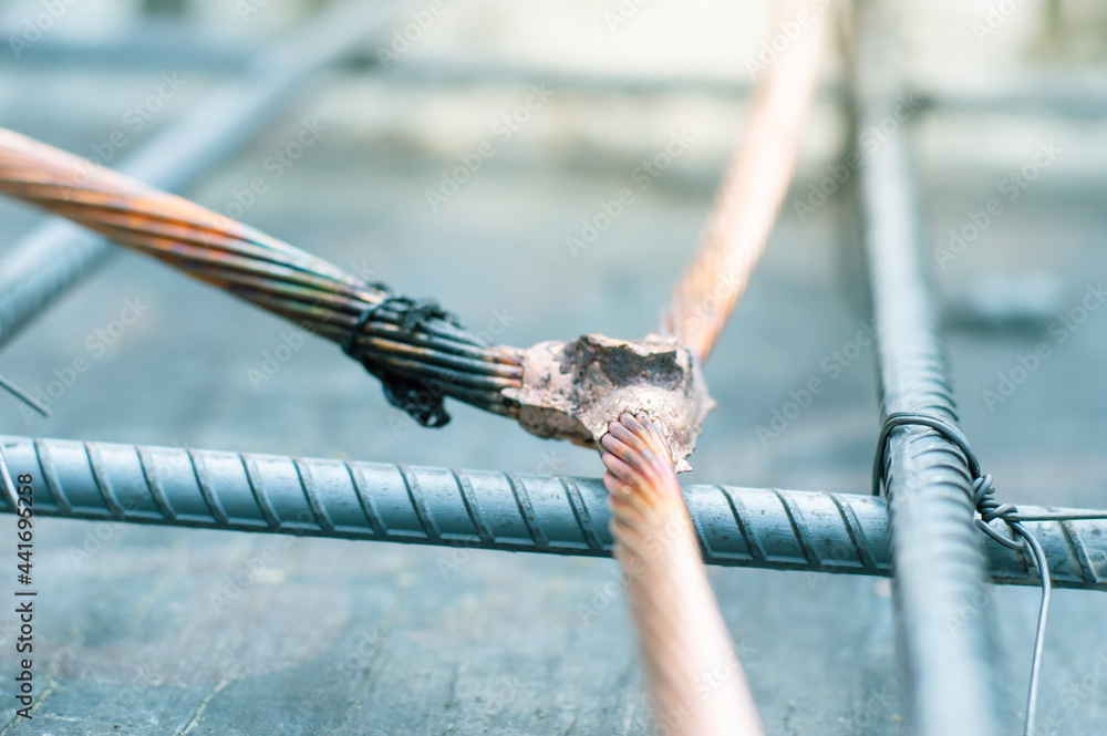 Welding copper ground wire on ground rod.Welding copper ground wire