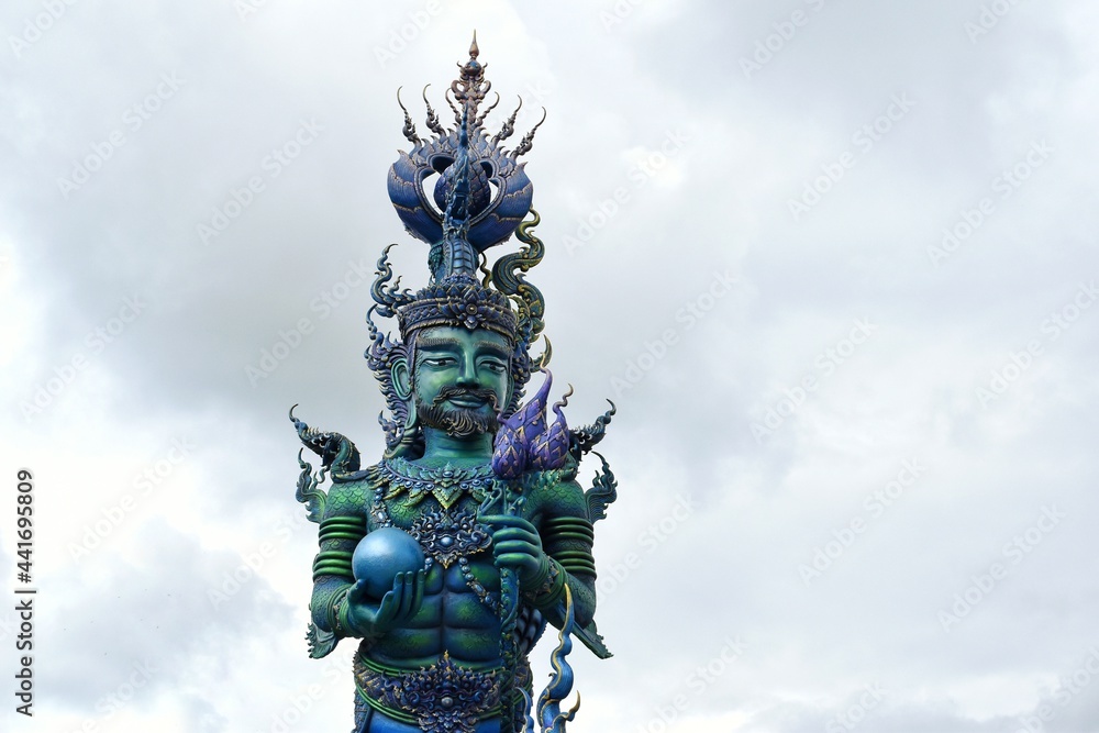 Sculptures of Chiang Rai Blue Temple or Wat Rong Seua Ten, Thai folklore and streaks of metallic gold, all contributing to the temple’s magnificence. Sculptures of Chiang Rai Blue Temple or Wat Rong Seua Ten, Thai folklore and streaks of metallic gold, all contributing to the temple’s magnificence.