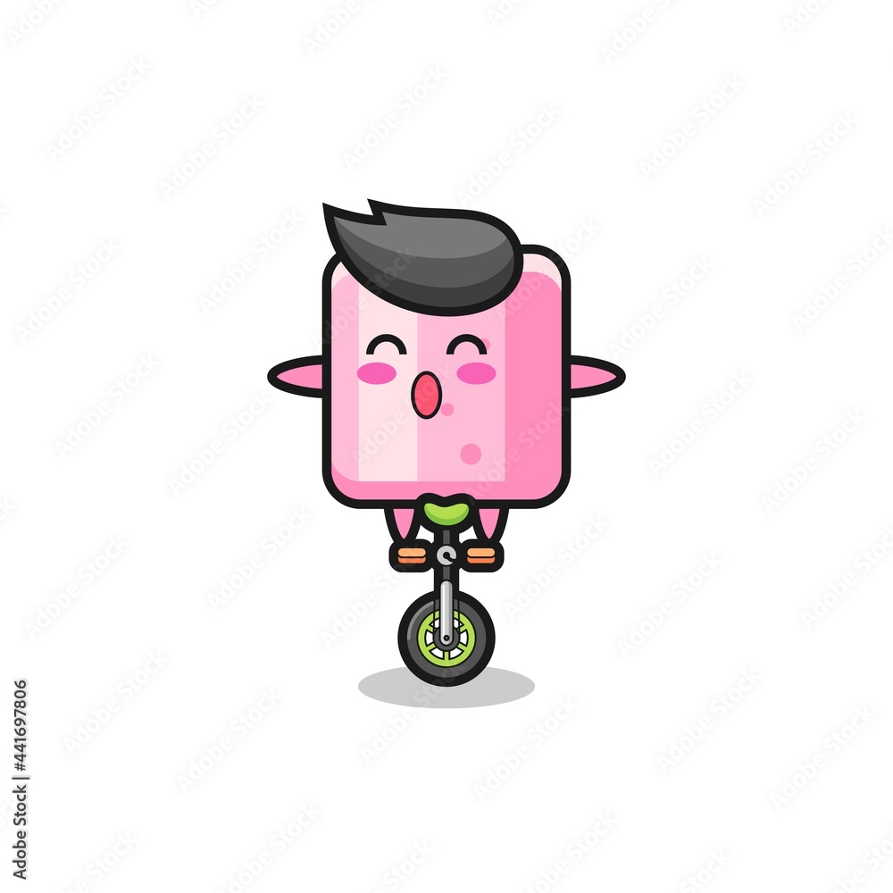 The cute marshmallow character is riding a circus bike The cute marshmallow character is riding a circus bike