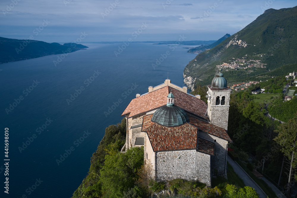 Catholic Church Eremo di Montecastello. Top view of the Eremo di Montecastello church. Aerial panorama of Montecastello. Lake Garda, Italy. Aerial view of the church on the mountain.