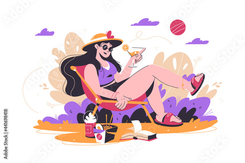 Woman relaxing in park with drink