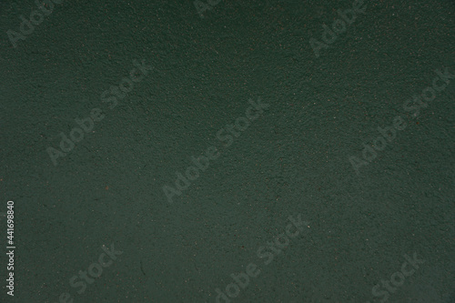 The shadow of the old cement  green  wall surface with cracks , texture , backgrounds for design