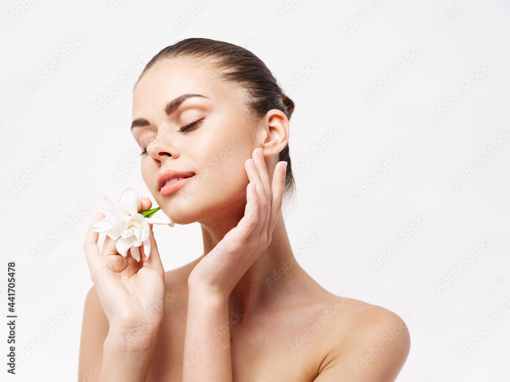 woman with bare shoulders closed eyes white flower cosmetics charm woman with bare shoulders closed eyes white flower cosmetics charm