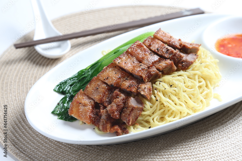 chef cook dry noodle mee with grilled chicken chop, pork cutlet and vegetable in soy sauce and chilli sauce asian halal menu chef cook dry noodle mee with grilled chicken chop, pork cutlet and vegetable in soy sauce and chilli sauce asian halal menu