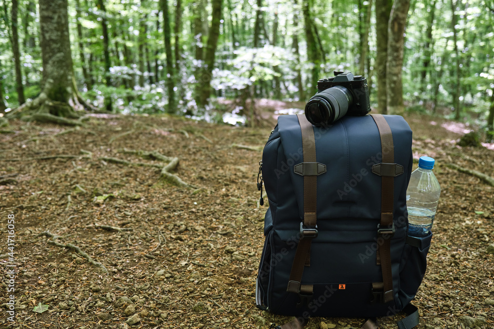 photo backpack in the mountains, photo backpack in the middle of the forest for hiking photo backpack in the mountains, photo backpack in the middle of the forest for hiking