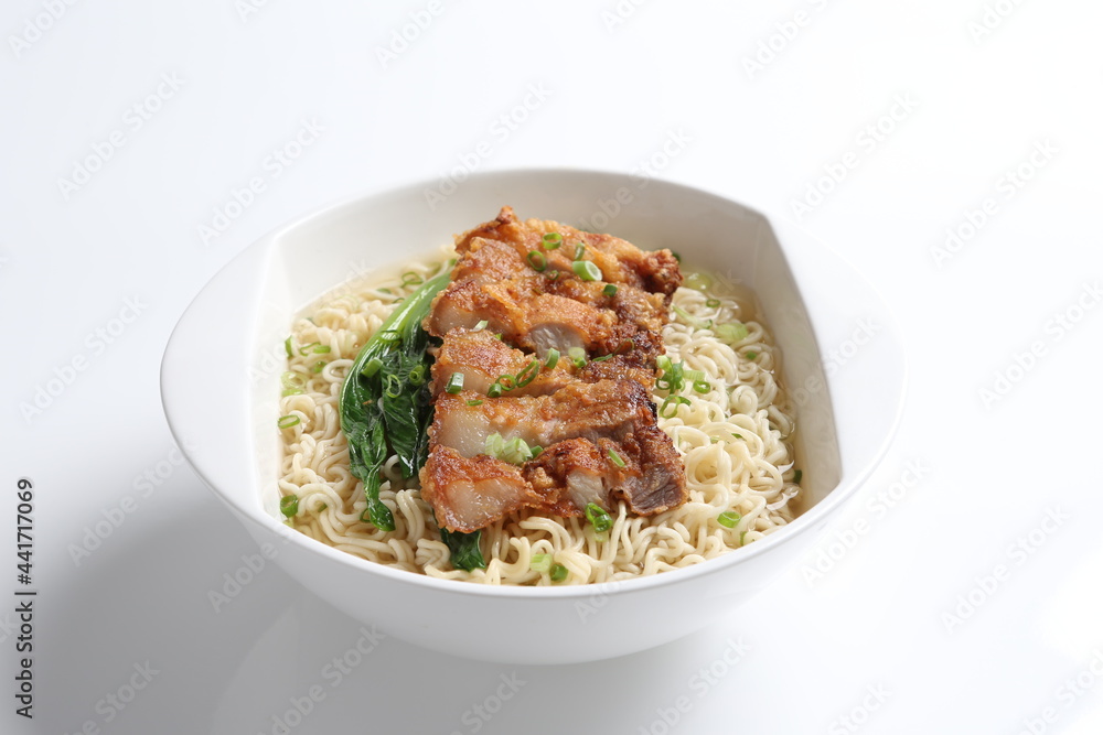 chef cook noodle mee soup with grilled chicken chop, pork cutlet and vegetable asian halal menu