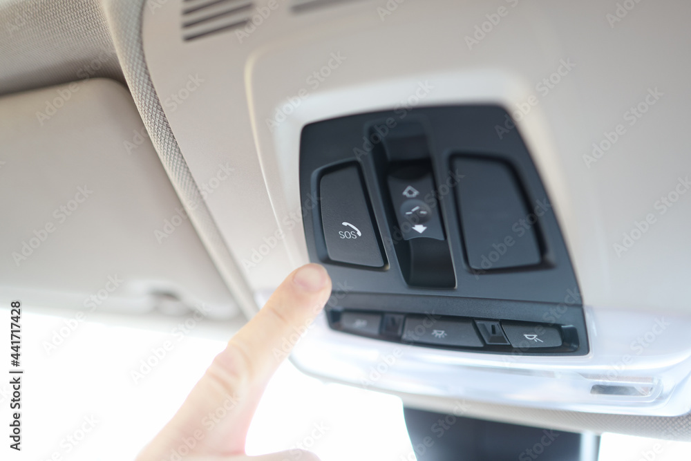 Man finger pressing sos emergency button to contact call center Man finger pressing sos emergency button to contact call center