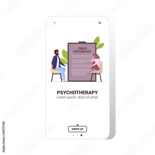male psychotherapist consulting depressed girl patient during psychotherapy session child psychology