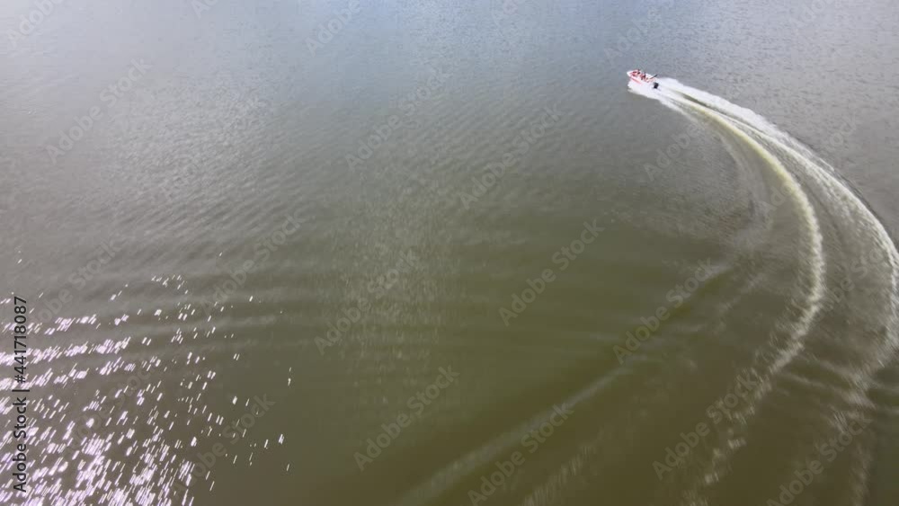 Fast motorboat on the Necko lake.A drone in pursuit of a motorboat on lake Necko
