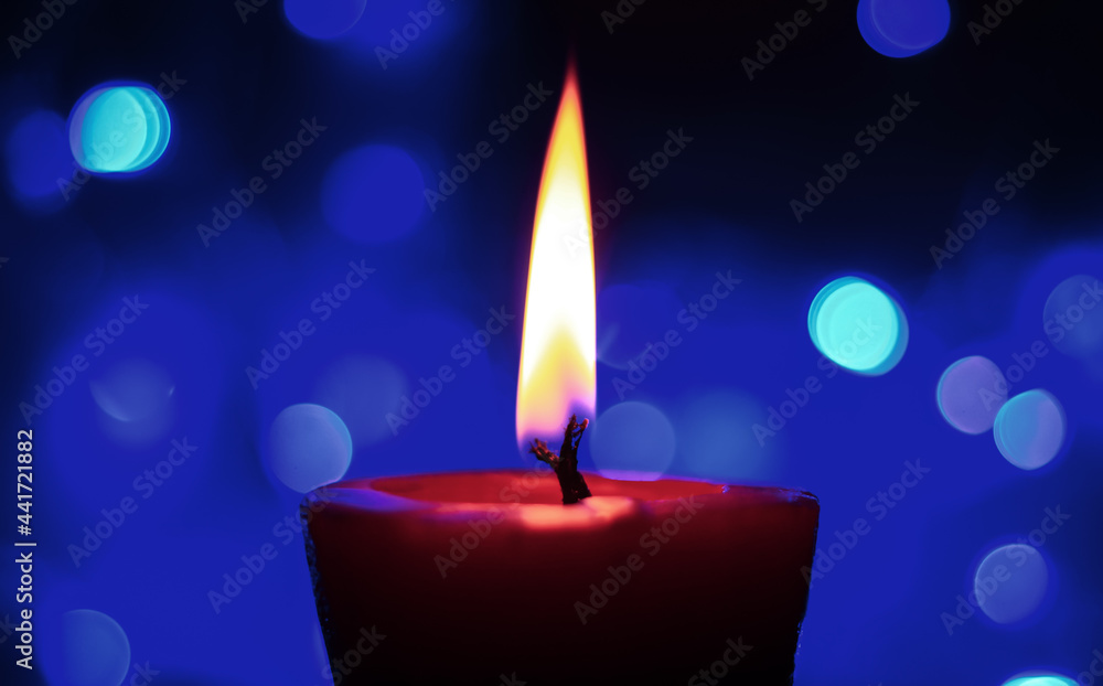 Candle lights in darkness with colorful light effects and bokeh for solemn moments and wallpaper. Candle flame light at night with the background. Candle lights in darkness with colorful light effects and bokeh for solemn moments and wallpaper. Candle flame light at night with the background.