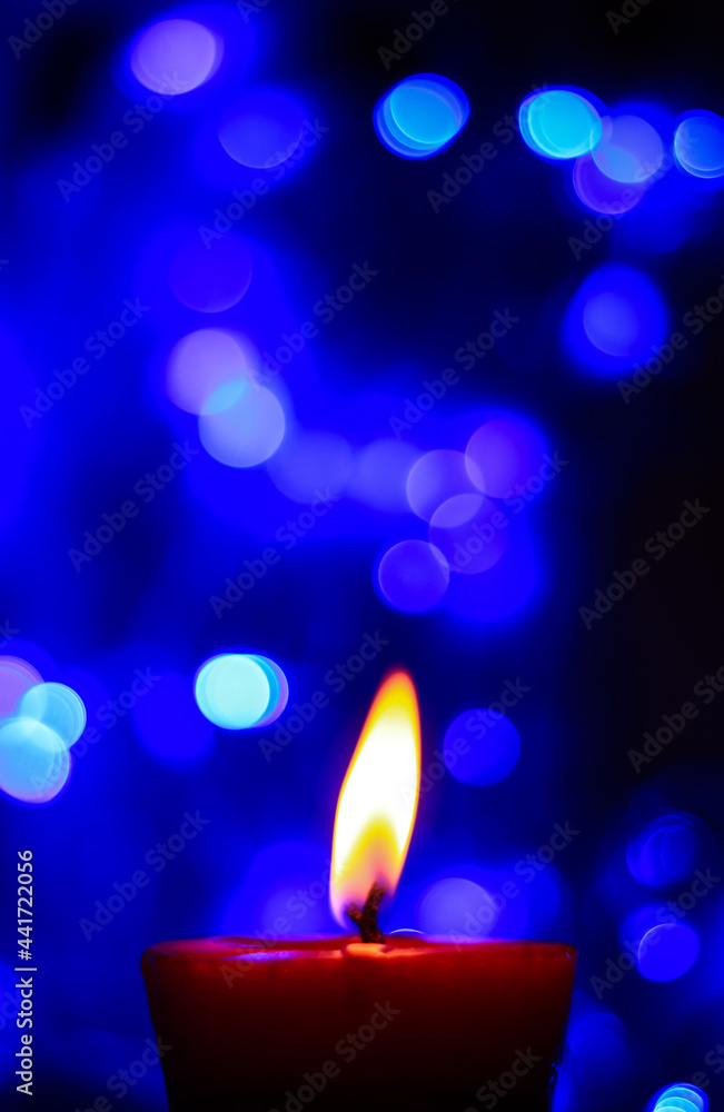 Candle lights in darkness with colorful light effects and bokeh for solemn  moments and wallpaper. Candle flame light at night with the background.  Stock Photo | Adobe Stock