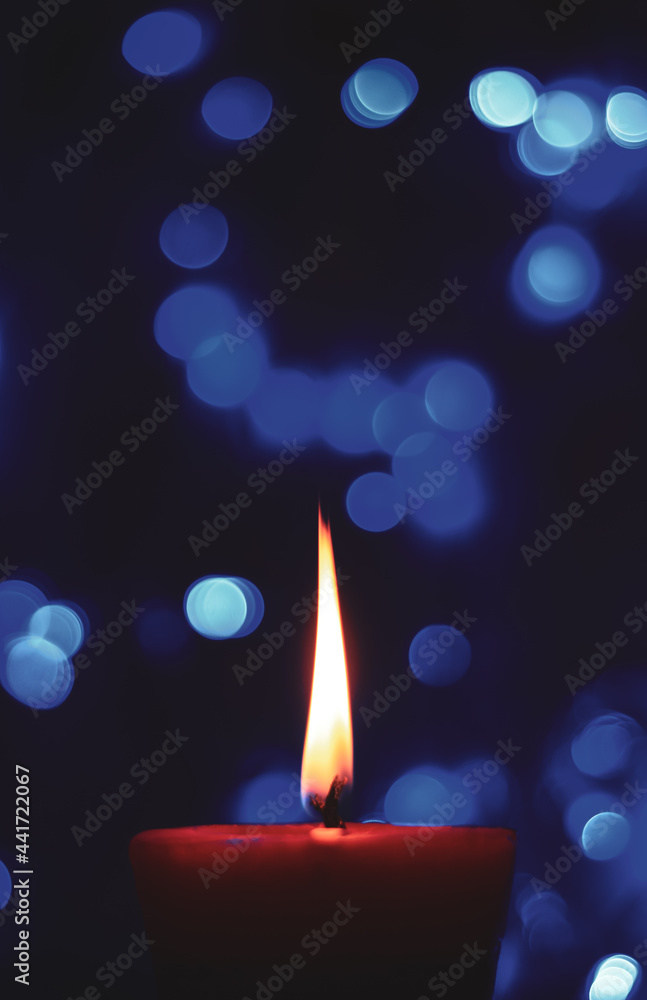 Candle lights in darkness with colorful light effects and bokeh for solemn moments and wallpaper. Candle flame light at night with the background. Candle lights in darkness with colorful light effects and bokeh for solemn moments and wallpaper. Candle flame light at night with the background.