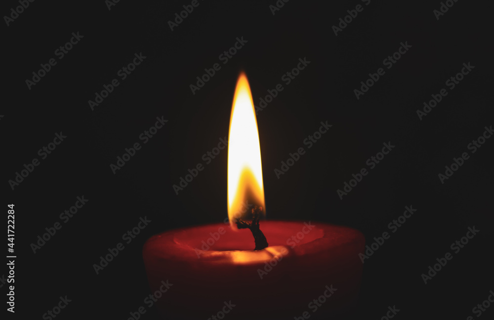 lighting candles, Burning candle on black background, Candle in the dark, Design for the background and wallpaper. copy space. lighting candles, Burning candle on black background, Candle in the dark, Design for the background and wallpaper. copy space.