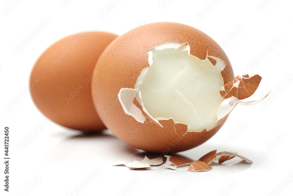 A cooked egg peeled on white background A cooked egg peeled on white background