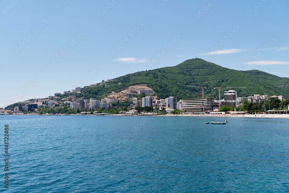 View from the sea to the buildings and the beach of Budva. Montenegro
