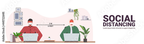 businesspeople working in protective masks colleagues keeping distance to prevent coronavirus social distancing