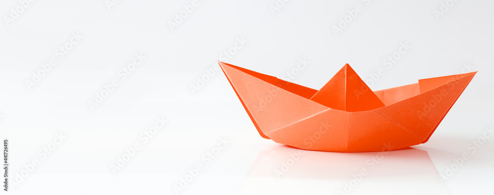 Red paper boat isolated on white background, banner with copy space Red paper boat isolated on white background, banner with copy space