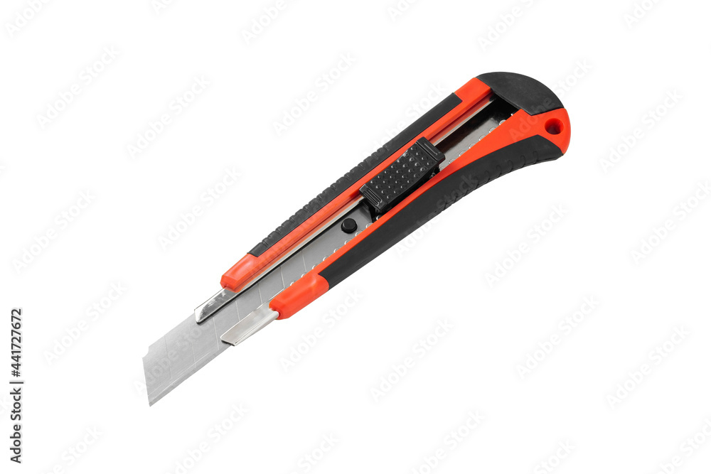 Stationery knife with black and red plastic handle. Close-up. Isolated on a white background. Stationery knife with black and red plastic handle. Close-up. Isolated on a white background.