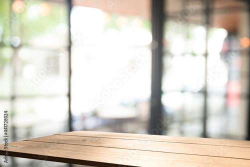 worn tabletop and window with day light © kishivan