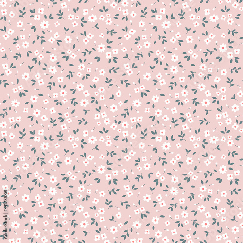 Vector seamless pattern. Pretty pattern in small flowers. Small white flowers. Light pink background. Ditsy floral background. The elegant the template for fashion prints. Stock vector.