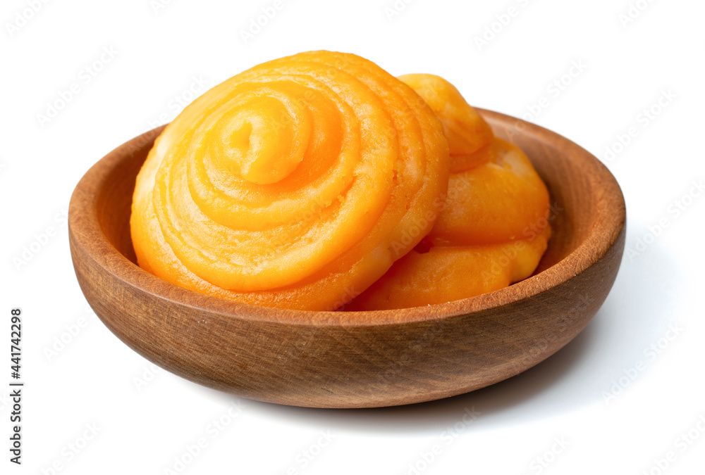 two cakes of plam sugar in the wooden bowl, isolated on white background two cakes of plam sugar in the wooden bowl, isolated on white background