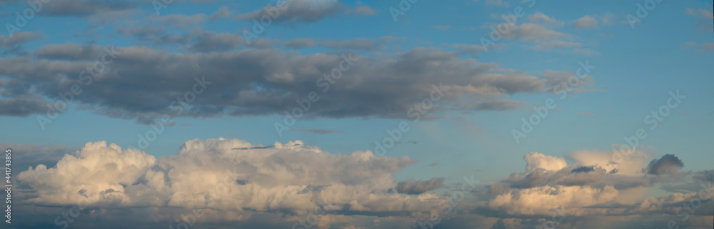 Russia. The South of Western Siberia. Gloomy sunset clouds in the evening summer sky over the fields of Altai. Russia. The South of Western Siberia. Gloomy sunset clouds in the evening summer sky over the fields of Altai.