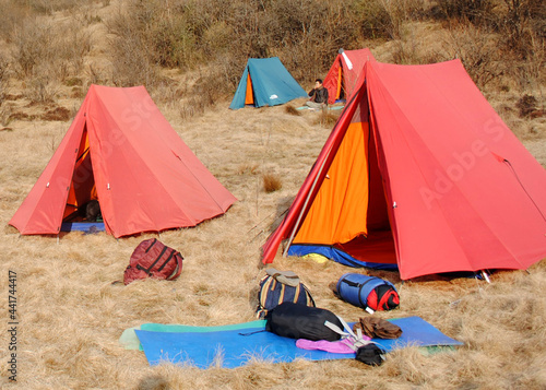 A panoramic view of trekkers tents perched at Singalilla Wildlife Sanctuary situated at 12,500 ft altitude in West Sikkim, India. This is the most popular trekking destination of Sikkim. photo