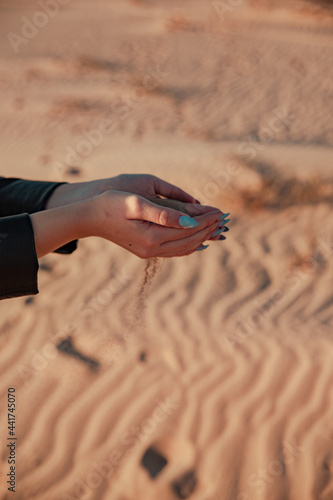 young girl hands playing with some sand