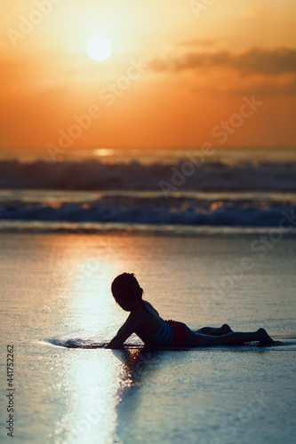 Happy girl have fun on tropical sea beach resort. Funny baby relax in sea water pool. Active kids lifestyle, people swimming activity on summer family holidays with children. Black silhouette. © Tropical studio