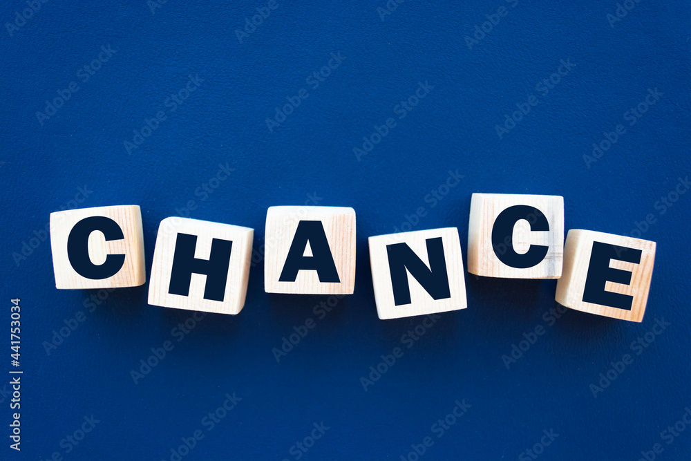 Obraz premium Chance inscription on wooden cubes on a blue background