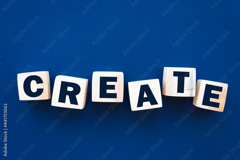 Obraz premium Create word on wooden cubes. Creativity development education concept.