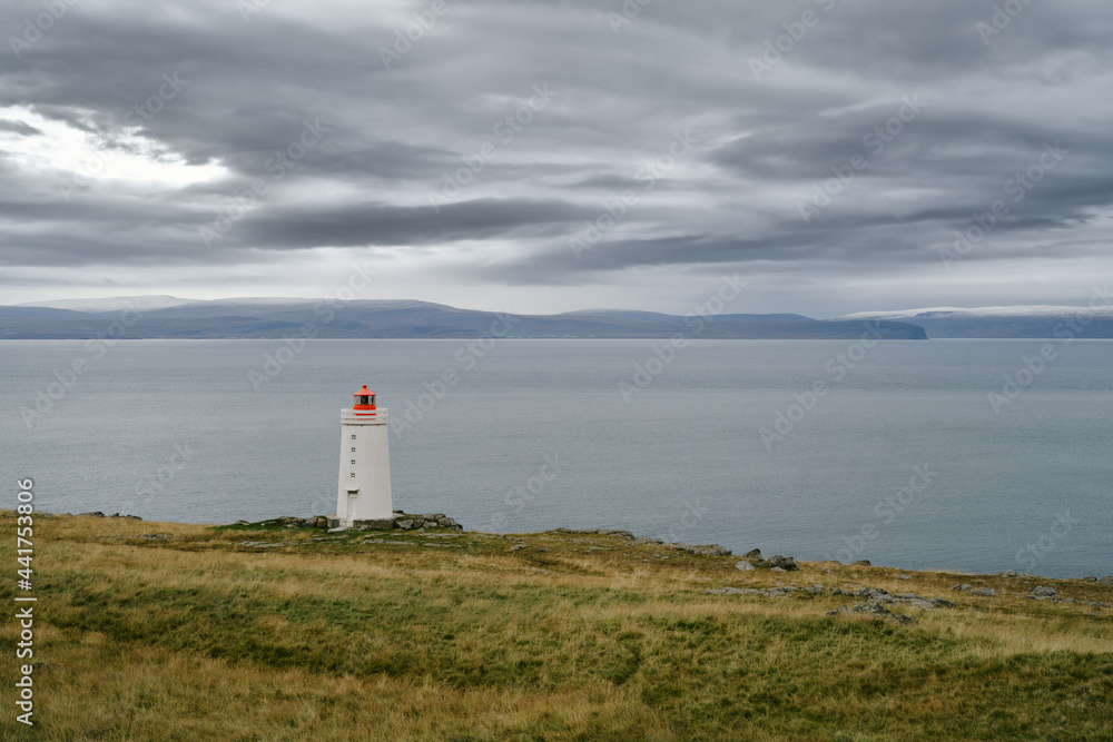 Lighthouse on the cliff near the ocean in Northwest Iceland