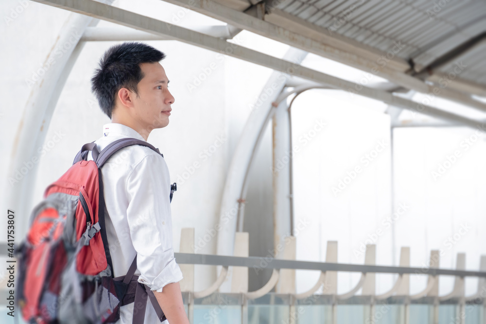 Asian traveler business man wearing face mask indeparture terminal in airport. Male passenger traveling by plane transportation during covid19 virus pandemic. vacation concept. Asian traveler business man wearing face mask indeparture terminal in airport. Male passenger traveling by plane transportation during covid19 virus pandemic. vacation concept.